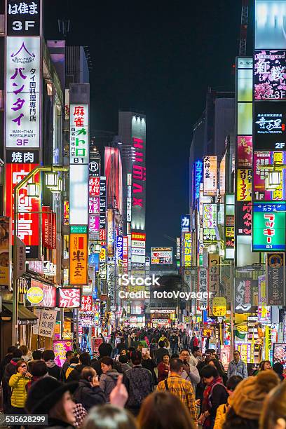 Tokyo Nightlife Crowded Streets And Colourful Neon Shopping Signs Japan Stock Photo - Download Image Now
