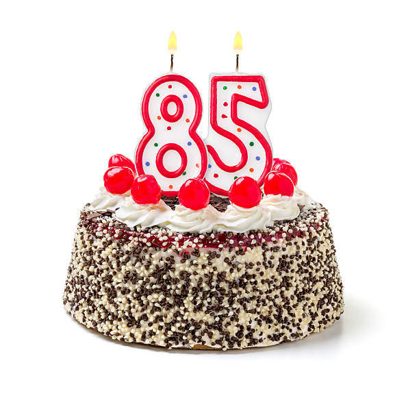 istock Birthday cake with burning candle number 85 535628491