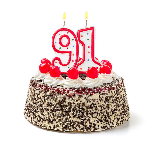istock Birthday cake with burning candle number 91 535628503