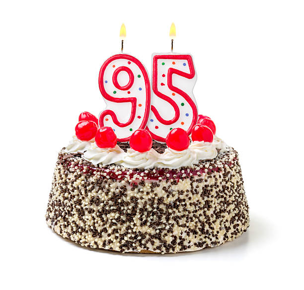 istock Birthday cake with burning candle number 95 535628513