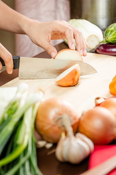 istock woman cutting vegetables 535629713