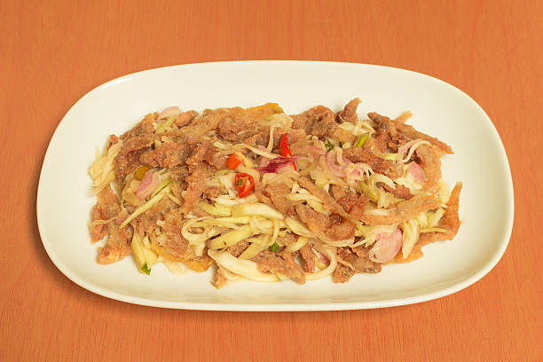 istock Crispy catfish salad with green mango 535630571