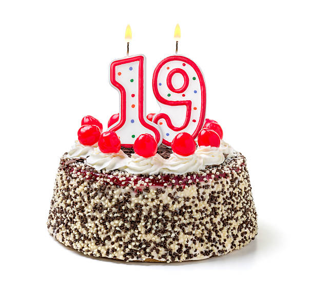 istock Birthday cake with burning candle number 19 535630959