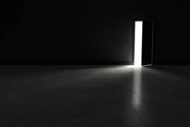 Photo of Door to dark room with bright light.  Background Illustration.