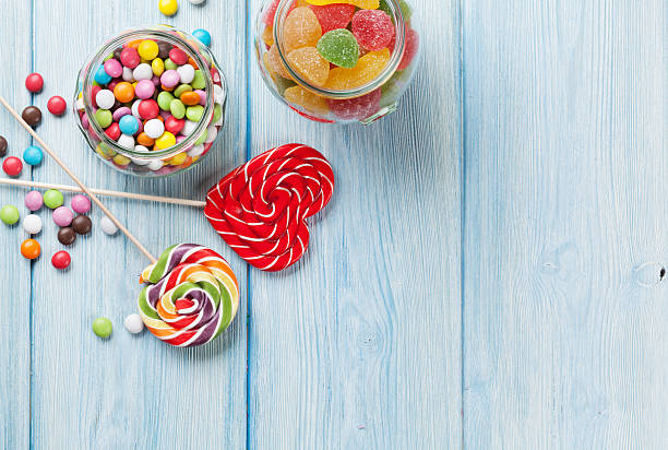 istock Colorful candies on wooden table 535631138