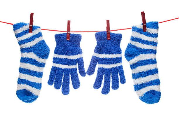 istock socks and gloves hang on rope 535631221