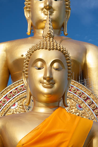 istock Gold buddha statue in Thai temple with clear sky. 535632561