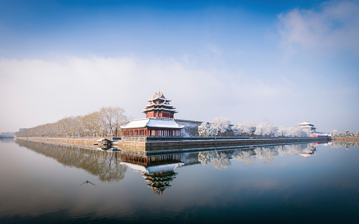 Snow on the North-East corner tower outside the Forbidden City in central Beijing.