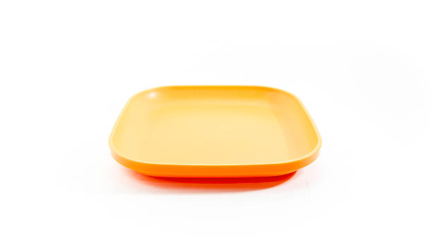 istock Empty and colourful luncheon plastic square luncheon food plates. 535633229