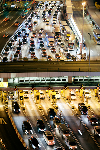 A busy toll plaza during the evening, light streaks, Hong Kong. 