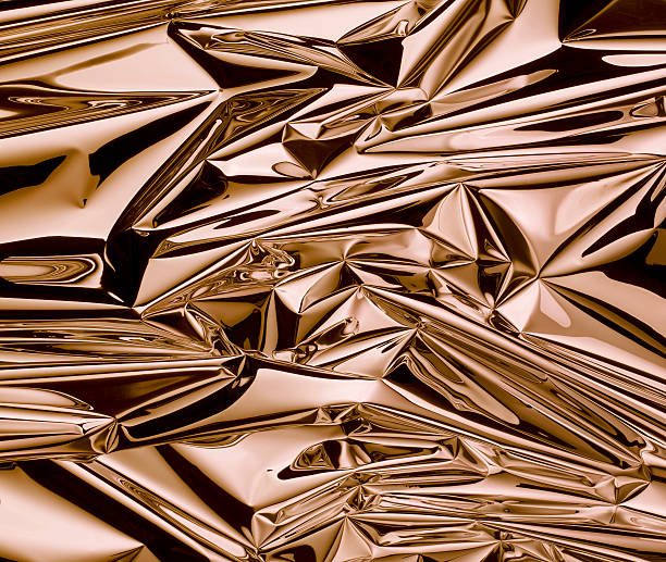 Close up of gold metallic foil photographed scrunched up.