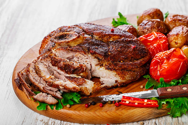 istock roasted pork shoulder on the bone with potatoes 535634473