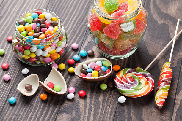 istock Colorful candies on wooden table 535634678