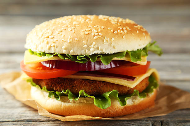 istock Fresh burger on grey wooden background 535634947