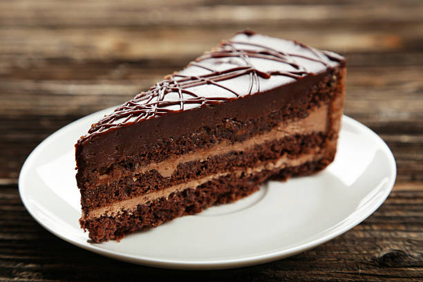 istock Dark chocolate cake on brown wooden background 535634969