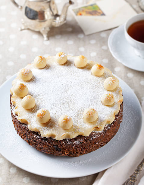 istock Traditional English Easter cake with marzipan decoration on white plate. 535645466
