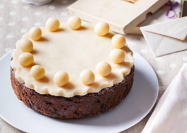 istock Traditional English Easter cake with marzipan decoration on white plate. 535646182