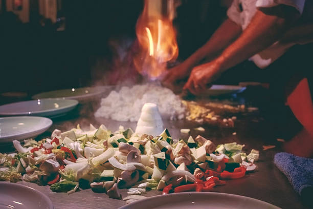 Teppanyaki restaurant. Chef cooking. stock photo