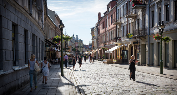 Kaunas, Lithuania - August 15, 2015: Pedestrians walk on Vilniaus gatve, the charming pedestrian artery in the Old Town of Kaunas, Lithuania.