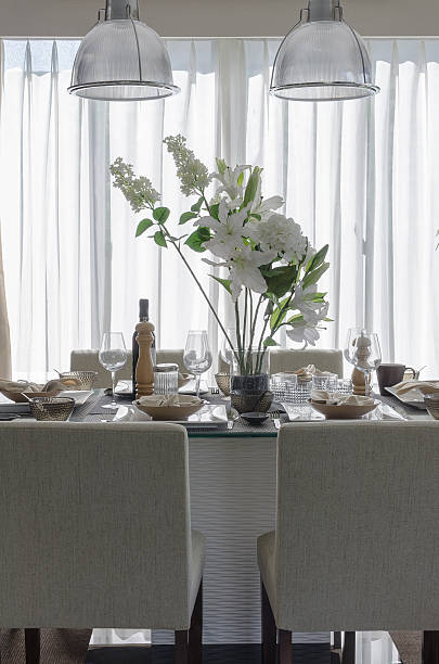 istock white modern dinning room with flower on table 535672281