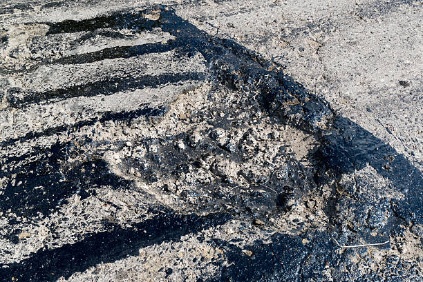 istock Road repair. Hole in  asphalt and bitumen 535673265
