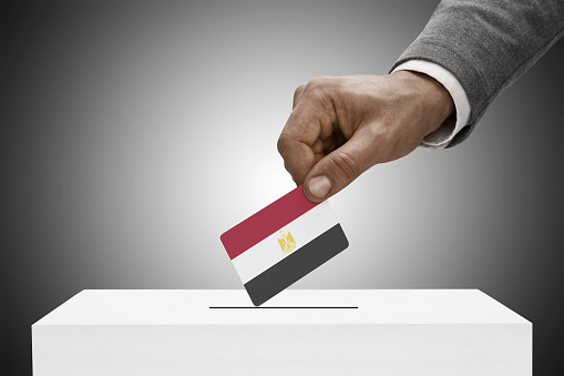 Black male holding flag. Voting concept - Arab Republic of Egypt