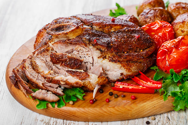 istock roasted pork shoulder on the bone with potatoes 535676837
