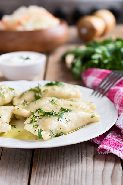 istock Varenyky on a white plate on wooden table 535677117