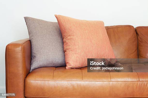 Close Up Of Tan Leather Sofa With Linen Cushions Stock Photo - Download Image Now - Beige, Danish Culture, Leather