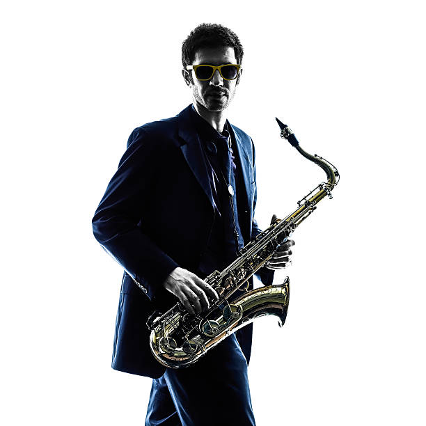 istock man saxophonist playing saxophone player  silhouette 535678803