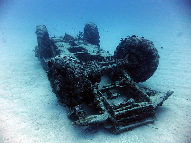 Sunken overturned jeep Underwater wreck of an armored military transport vehicle in Carribean sea. (Cuba) bay of pigs invasion stock pictures, royalty-free photos & images