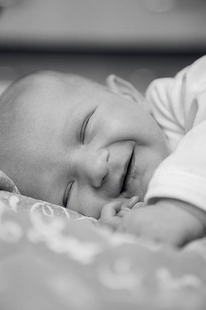istock Newborn baby smiles 535679551
