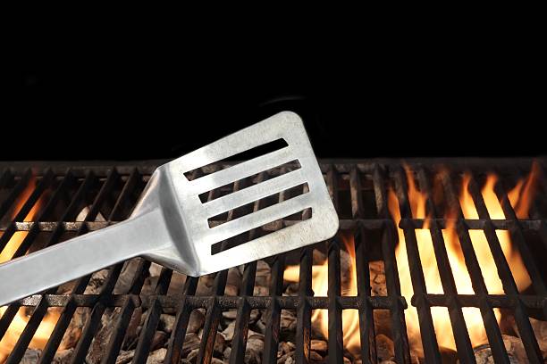 istock Spatula on the Flaming BBQ Grill 535683263