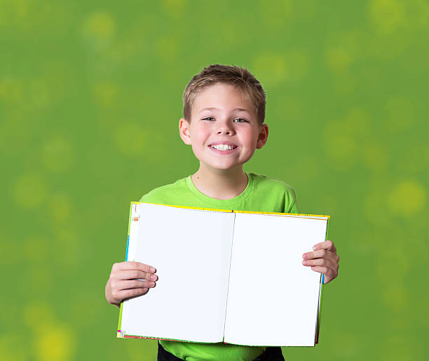 istock Happy boy holding book with empty copy space. Education concept. 535683649