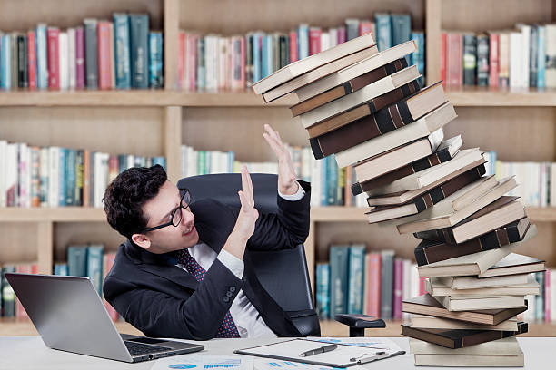 istock Caucasian businessman with books 535697175