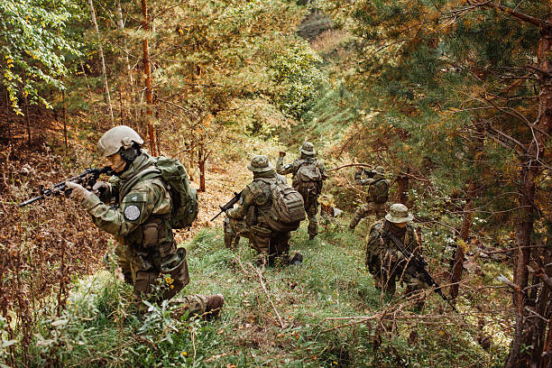 istock group of military intelligence in the woods leads 535697385