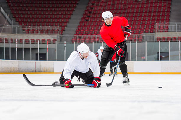 istock Two Ice Hockey Players After a Hard Duell 535699181