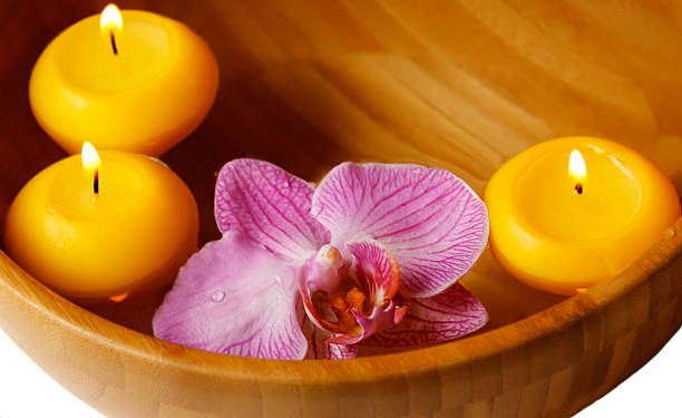 istock Floating candles and orchide flower 535700865