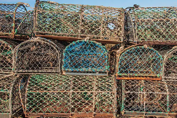 A stack of lobster pots by the sea, ready to used again