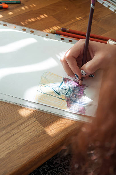 istock Woman hand using pencil drawing, sketching on paper 535716911