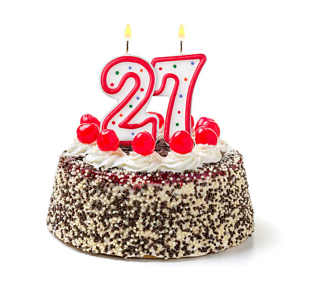 istock Birthday cake with burning candle number 27 535718393
