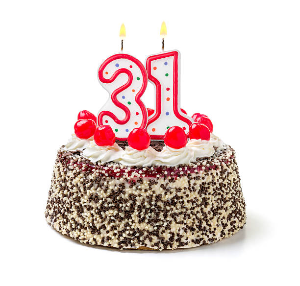 istock Birthday cake with burning candle number 31 535718403