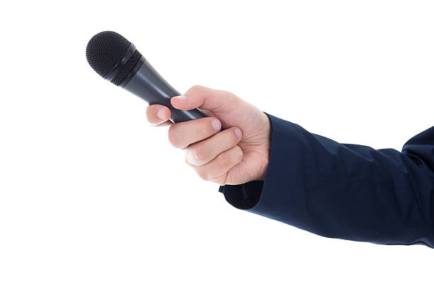 istock male hand with microphone isolated on white 535718597