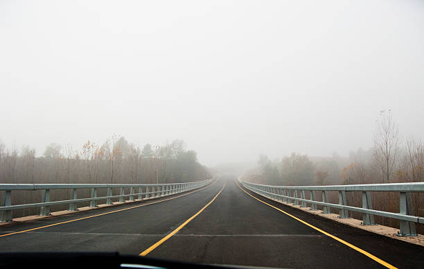 istock Car in a fog road 535718885