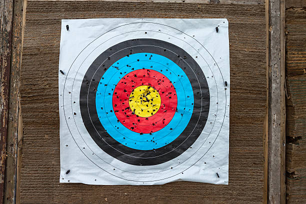 istock Archery target pinned to a wall with many holes 535719129