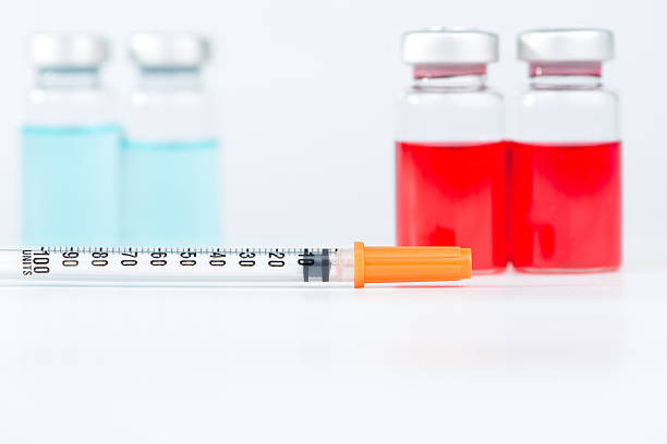 istock Disposable syringe and injection vials 535721915