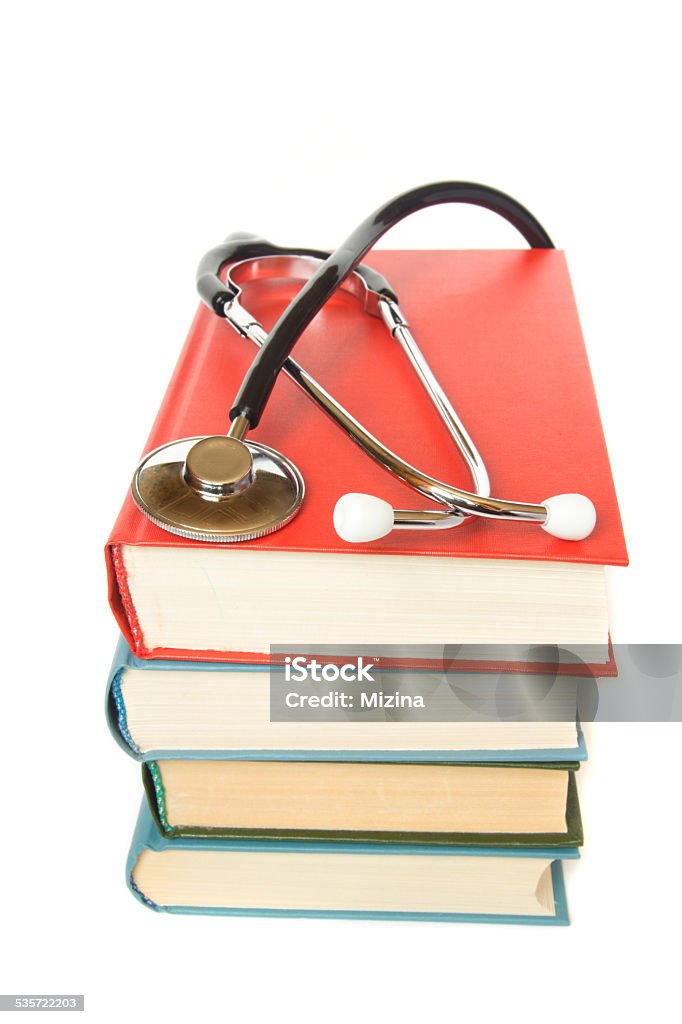 stethoscope and  stack of books stethoscope and  stack of books close up isolated on white background. Medical professional education and information concept. 2015 Stock Photo