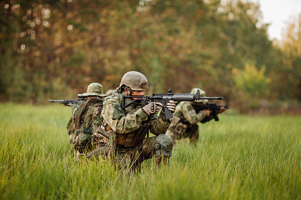 istock soldiers shoot at the enemy 535722557