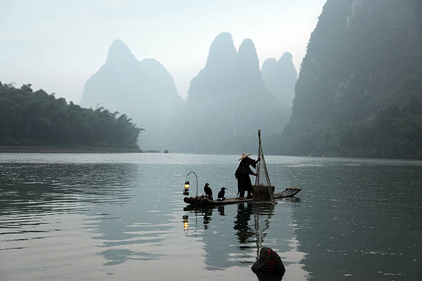 istock Fishing with cormorants birds in Yangshuo 535722559