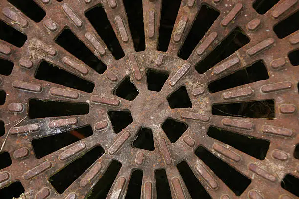 a old dirty Manhole cover close-up